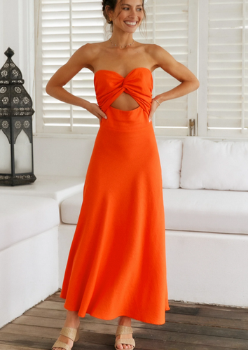 Perfect for summer days this maxi dress by Fortunate One is simply stunning in glowing orange cotton/linen.  Twisted front feature with underbust cutout, and a shirred, stretchy back pan