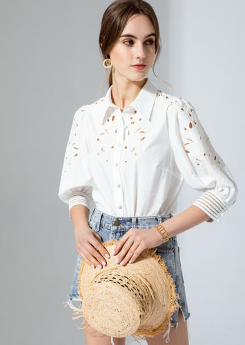 Simplicity in white! The stunning Latizia blouse by GDS comes with a fine cotton construction and embroidered detail on the sleeves and front.  The cut outs are trimmed in a soft cream cotton giving the blouse a lovely vintage tone.  Beautifully made, the 3/4 length sleeves are slightly puffed with a lovely embroidery detail and finished with exquisitely detailed cuffs, which are also buttoned.  