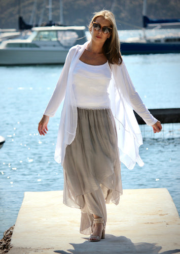Made in Italy, this soft lightweight silk/viscose Primadonna Cardigan will become a favourite layering item this season!  Layer it over a cami, or the Primadonna Feather top, with trousers, a dress or a skirt. The beautiful silky lapel and frilled hem drape elegantly, perfect for the evening, special events or weddings, but looks just as good layered with a top over jeans