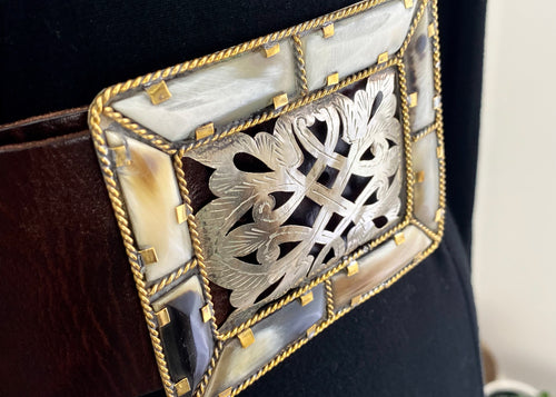 The Aziza Wide Bone Filigree Buckle Belt makes quite a statement.  In a 7cm wide  rich chocolate leather, the buckle is a stunning luxury bohemian piece, crafted from bone and detailed filigree cut metal work to create a truly unique design that will be the focus of your outfit.