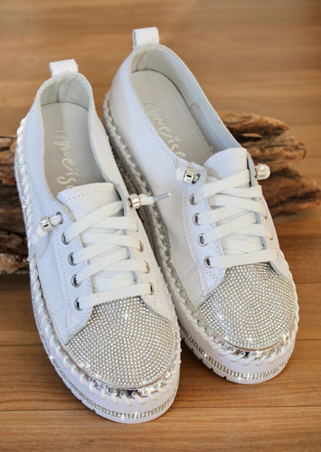 Sky Crystal women's casual sneakers from Ameise.  The soft white all leather upper is studded with crystals along the side and trimmed with a silver band. 