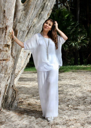 Keep it soft and feminine in these beautiful Italian made silk Primadonna Prima Pants in white on white Stripe.   The loose cut pants with a soft white on white stripe and wide jersey waistband, are fully lined and designed for relaxed style and comfort. 
