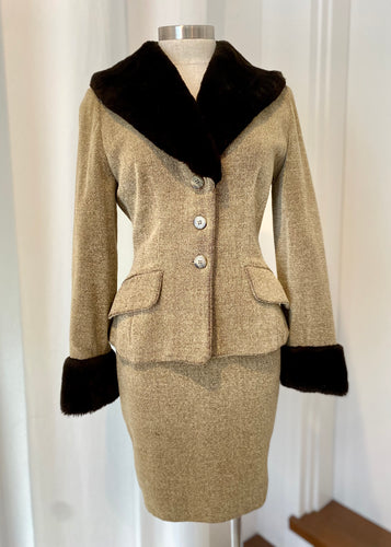 Brand: Hexagon Circa: 1990 Style: tailored wool blend suit, fitted jacket, pencil skirt Preloved Colour: beige with dark brown faux fur trim Fabric: 56% wool, acrylic 8%, cotton 13%, nylon 23% lined dry clean Size T 1 (french) or 38 Made in France