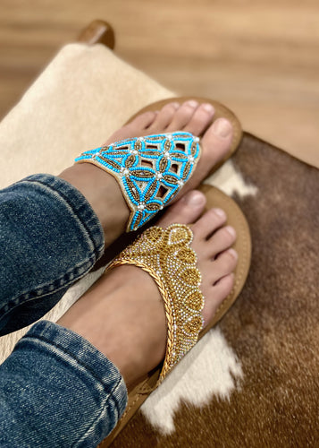 Our gold beaded all leather slide in a classic shape with contemporary detailing. These gorgeous slides can be worn day or night to add a little distinction to any ensemble.