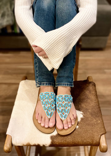 This beaded leather Slide in gorgeous turquoise and white beading, is a sandal that will finish off any outfit with relaxed glamour and sparkle!
