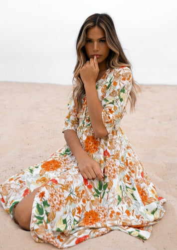 The beautiful Ravello floral print Isla Maxi Dress by Caro The Label.  The gorgeous print in autumnal colour palette represent the colours of Australian flowers!  The long loose flowing skirt skims the body flattering the figure.