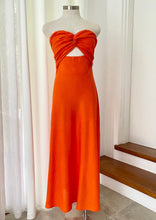Load image into Gallery viewer, Perfect for summer days this maxi dress by Fortunate One is simply stunning in glowing orange cotton/linen.  Twisted front feature with underbust cutout, and a shirred, stretchy back pan
