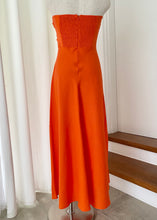 Load image into Gallery viewer, Perfect for summer days this maxi dress by Fortunate One is simply stunning in glowing orange cotton/linen.  Twisted front feature with underbust cutout, and a shirred, stretchy back pan
