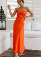 Load image into Gallery viewer, Perfect for summer days this maxi dress by Fortunate One is simply stunning in glowing orange cotton/linen.  Twisted front feature with underbust cutout, and a shirred, stretchy back pan

