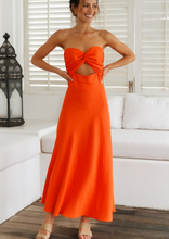Load image into Gallery viewer, Perfect for summer days this maxi dress by Fortunate One is simply stunning in glowing orange cotton/linen.  Twisted front feature with underbust cutout, and a shirred, stretchy back pan
