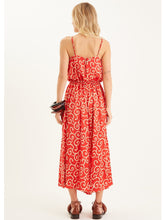 Load image into Gallery viewer, The perfect jumpsuit to pack on holiday, or those days when you cant decide what to wear!  It will take you effortlessly from beach to lunch or desk to dinner!  Beautiful lightweight Rayon voil fabric is cool and comfortable and looks sensational in the swirling coral print which floats elegantly with every move. 
