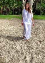 Load and play video in Gallery viewer, Keep it soft and feminine in these beautiful Italian made silk Primadonna Prima Pants in white on white Stripe.   The loose cut pants with a soft white on white stripe and wide jersey waistband, are fully lined and designed for relaxed style and comfort. 
