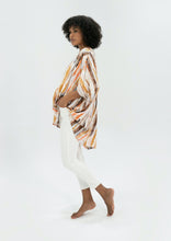 Load image into Gallery viewer, The Basic Top by Caro The Label, is another best seller.   In a gorgeous print of earthy tones that represent the colours of outback Australia.  Crafted from soft 100% Rayon fabric is lightweight and cool, slightly longer at the back and loose flowing, perfect with jeans or leggings, even shorts.  3/4 length wide sleeves create a relaxed but flattering shape that can be dressed up or down, for the beach or the bar!
