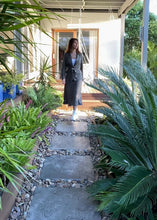 Load and play video in Gallery viewer, The Ada Jacket is a relaxed blazer-style jacket, in a beautiful Linen blend fabric, in 2 subtle earthy tones.  GDS design principles reflect a mix between business and casual fashion, with a feminine and elevated approach to clothing in high-quality materials.  The Ada jacket cuts a flattering figure, a cinched waist with a matching belt and single large button.  The collar, hem, pockets and cuffs are frayed at the edges, which adds a gorgeous bohemian touch to a timeless silhouette.
