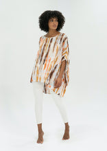 Load image into Gallery viewer, The Basic Top by Caro The Label, is another best seller.   In a gorgeous print of earthy tones that represent the colours of outback Australia.  Crafted from soft 100% Rayon fabric is lightweight and cool, slightly longer at the back and loose flowing, perfect with jeans or leggings, even shorts.  3/4 length wide sleeves create a relaxed but flattering shape that can be dressed up or down, for the beach or the bar!
