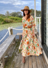 Load and play video in Gallery viewer, The beautiful Ravello floral print Isla Maxi Dress by Caro The Label.  The gorgeous print in autumnal colour palette represent the colours of Australian flowers!  The long loose flowing skirt skims the body flattering the figure.
