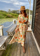 Load image into Gallery viewer, The beautiful Ravello floral print Isla Maxi Dress by Caro The Label.  The gorgeous print in autumnal colour palette represent the colours of Australian flowers!  The long loose flowing skirt skims the body flattering the figure.
