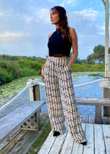 Load image into Gallery viewer, Made for effortless elegance, these Rayon Mar tailored wide leg trousers in trousers in an abstract graphic design of black/off white, will take you effortlessly from desk to dinner !  Lightweight with an elegant high waist, these pants feature 2 front pockets and a flattering tailored fit.  The high waist lengthens the silhouette and the lightweight fabric is both comfortable and cool and floats elegantly with every move.
