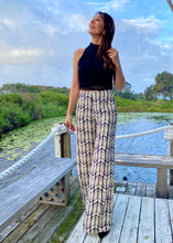 Load image into Gallery viewer, Made for effortless elegance, these Rayon Mar tailored wide leg trousers in trousers in an abstract graphic design of black/off white, will take you effortlessly from desk to dinner !  Lightweight with an elegant high waist, these pants feature 2 front pockets and a flattering tailored fit.  The high waist lengthens the silhouette and the lightweight fabric is both comfortable and cool and floats elegantly with every move.
