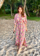 Load image into Gallery viewer, The Beatrice Dress -  the long loose flowing skirt lightly skims the body flattering the figure.  The silk blend fabric is lightweight and cool. The skirt is split at the sides to the knee and the V neckline crosses the bust with a drawstring tie under the bust, creating a flattering silhouette.  Finished with wide short bell sleeves, you will feel utterly feminine in the pretty floral print. 
