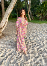 Load image into Gallery viewer, The Beatrice Dress -  the long loose flowing skirt lightly skims the body flattering the figure.  The silk blend fabric is lightweight and cool. The skirt is split at the sides to the knee and the V neckline crosses the bust with a drawstring tie under the bust, creating a flattering silhouette.  Finished with wide short bell sleeves, you will feel utterly feminine in the pretty floral print. 
