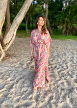 Load image into Gallery viewer, The Beatrice Dress -  the long loose flowing skirt lightly skims the body flattering the figure.  The silk blend fabric is lightweight and cool. The skirt is split at the sides to the knee and the V neckline crosses the bust with a drawstring tie under the bust, creating a flattering silhouette.  Finished with wide short bell sleeves, you will feel utterly feminine in the pretty floral print. 
