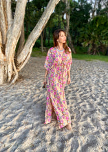 Load image into Gallery viewer, The Beatrice Dress -  the long loose flowing skirt lightly skims the body flattering the figure.  The silk blend fabric is lightweight and cool. The skirt is split at the sides to the knee and the V neckline crosses the bust with a drawstring tie under the bust, creating a flattering silhouette.  Finished with wide short bell sleeves, you will feel utterly feminine in the pretty floral print. 
