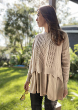 Load image into Gallery viewer, The Winnie Knit Shirt by Bagira is a stylish knitted jumper with a combined shirt layer for a unique layered look.  In a gorgeous soft Latte colour, the beautiful cable knit is finished with a very pretty scalloped edge, and pattern detail down the arms.  The cotton under shirt is oversized and gathered, creating a very luxurious Boho style top that pairs well with jeans, trousers or leggings.   
