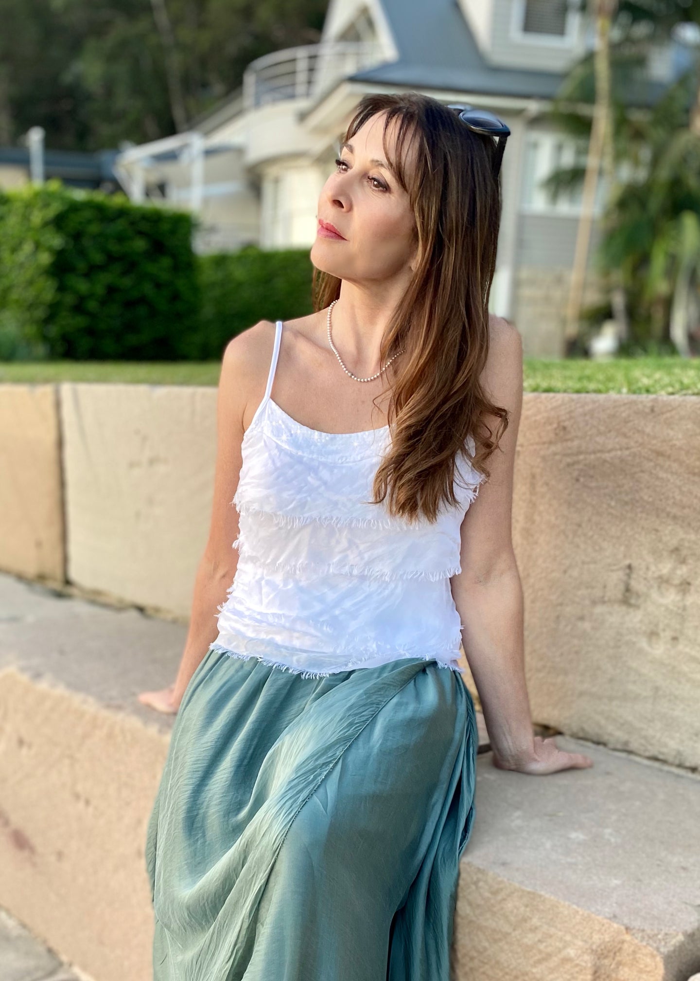 Fashion loves a little romance!  Discover your love for Italian made fashion with the Primadonna Feather Singlet by Jenny Jazz!   This soft raw cut silk is tiered on the front, with a delicate sequin neckline to add a touch of feminine glamour to any outfit. 