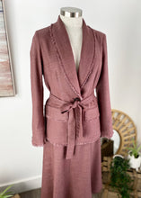 Load image into Gallery viewer, The Ada Jacket is a relaxed blazer-style jacket, in a beautiful Linen blend fabric, in 2 subtle earthy tones, a soft Beaujolais Nouveau Wine colour and a pastel Grey/Green.   The Ada jacket cuts a flattering figure, a cinched waist with a matching belt and single large button.  The collar, hem, pockets and cuffs are frayed at the edges, which adds a gorgeous bohemian touch to a timeless silhouette
