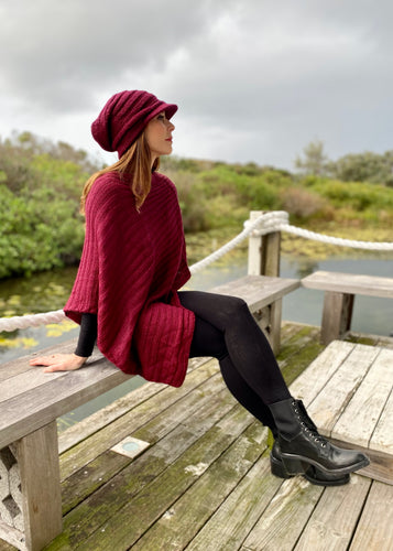 This soft Mohair/acrylic knitted Cap exudes a sassy, bohemian style.  Knitted in a light weight yarn, the pretty knit features a ribbed pattern in a generous slouchy style.  It is sure to keep your pretty head snug, warm and stylish through winter and spring!  Wear it with our Mohair blend Poncho.