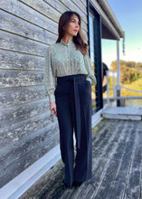 Load image into Gallery viewer, The stunning Isla Pleated blouse, beautifully made with cuffed full length sleeves, a frill neck and statement gold buttons down the front.  An abstract graphic design adorns this blouse with pleats and delicate gold elements add to the wow factor of this design.  Pair with jeans, or with tailored trousers or skirt for a more formal look.  For women who want to look elegant and effortlessly stylish from desk to dinner. 
