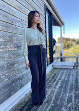 Load image into Gallery viewer, The stunning Isla Pleated blouse, beautifully made with cuffed full length sleeves, a frill neck and statement gold buttons down the front.  An abstract graphic design adorns this blouse with pleats and delicate gold elements add to the wow factor of this design.  Pair with jeans, or with tailored trousers or skirt for a more formal look.  For women who want to look elegant and effortlessly stylish from desk to dinner. 
