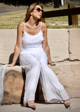 Load image into Gallery viewer, Keep it soft and feminine in these beautiful Italian made silk Primadonna Prima Pants in white on white Stripe.   The loose cut pants with a soft white on white stripe and wide jersey waistband, are fully lined and designed for relaxed style and comfort. 
