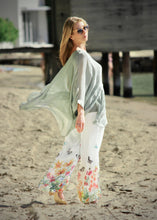 Load image into Gallery viewer, As light as air, made from a delicate Italian silk blend, the Layered Silk Blend top by Jenny Jazz is super elegant, and creates a gorgeous feminine silhouette.  With a combined viscose singlet for cover, your every move is expressed in the soft lightweight silk blend fabric. The sheer winged sleeves are layered across the front and float delicately with the hemline which finishes on the thigh at the front, sage green
