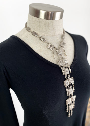 Silver plated square discs cascade to create a lovely flattering bohemian necklace. Beautifully made from quality silver plated pewter, the square discs are stamped with an intricate pattern and linked to silver plated beads and chain.  Quite simply a stunning statement piece that will finish any outfit, especially a simple dress or your favourite jeans.* Country of Origin - Turkey  * Length: 44cms, 