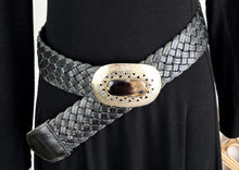 Load image into Gallery viewer,  The beautiful Marrakesh Wide Leather Belt is a 6cm wide woven leather belt with an oval bone inlay set in an engraved metal buckle.   A real show stopper, looks sensational with any outfit.
