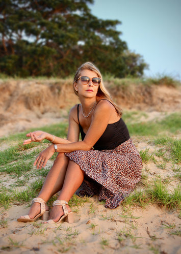 This gorgeous silk blend leopard print wrap skirt, is certain to flatter many figures.  The wrap around design with frill detail, is all at once sophisticated and sassy and the silk blend fabric is lightweight and cool to wear.  Wear to the office with heals and a blouse, or keep it relaxed with a singlet and slides, this versatile skirt is sure to become a year long favourite.