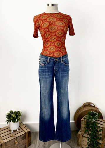 Brand: Kookai Circa: 1999? Style: fitted, slim T shirt Preloved: yes Colour: Burnt orange pattern Fabric: 100% Polyamide Nylon hand wash only Size 10 UK