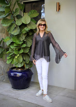 Load image into Gallery viewer, The Nadia silk blend top oozes relaxed sophistication. Made in Italy, this delicate silk blend top has a combined soft viscose singlet. It has a V neck and soft pleat down the front, and the sheer sleeves are finished with a delicate frill to create a very romantic feminine top that can be worn with anything
