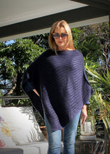 Load image into Gallery viewer, This soft Mohair/acrylic knit Poncho feels light weight and warm and is easily thrown over the shoulders to keep out the winter chills.  The ribbed knit creates a lovely and eye catching pattern that crosses the body.  Looks awesome worn over a jumper and jeans finished off with a cap
