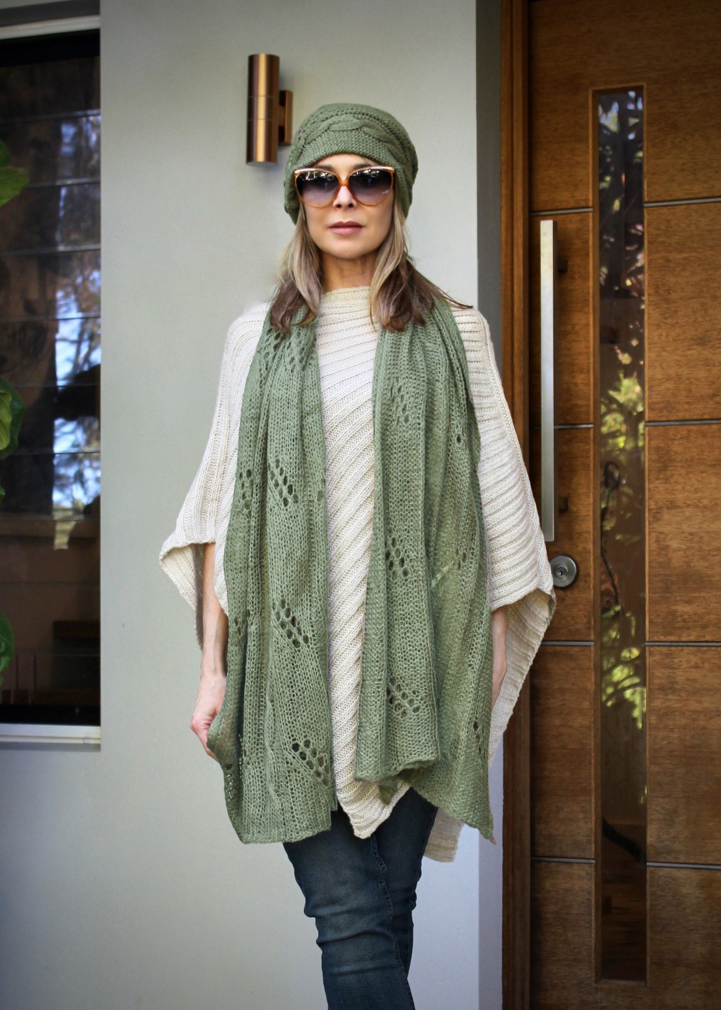 A soft versatile scarf that also doubles as a summer wrap for a layer of added warmth in summer.  This soft Mohair/acrylic knit feels light weight and warm when worn as a scarf in winter, and perfect thrown around the shoulders to keep out any chills in spring and summer.   The pretty knit combines a cable pattern to create a lovely and eye catching pattern.