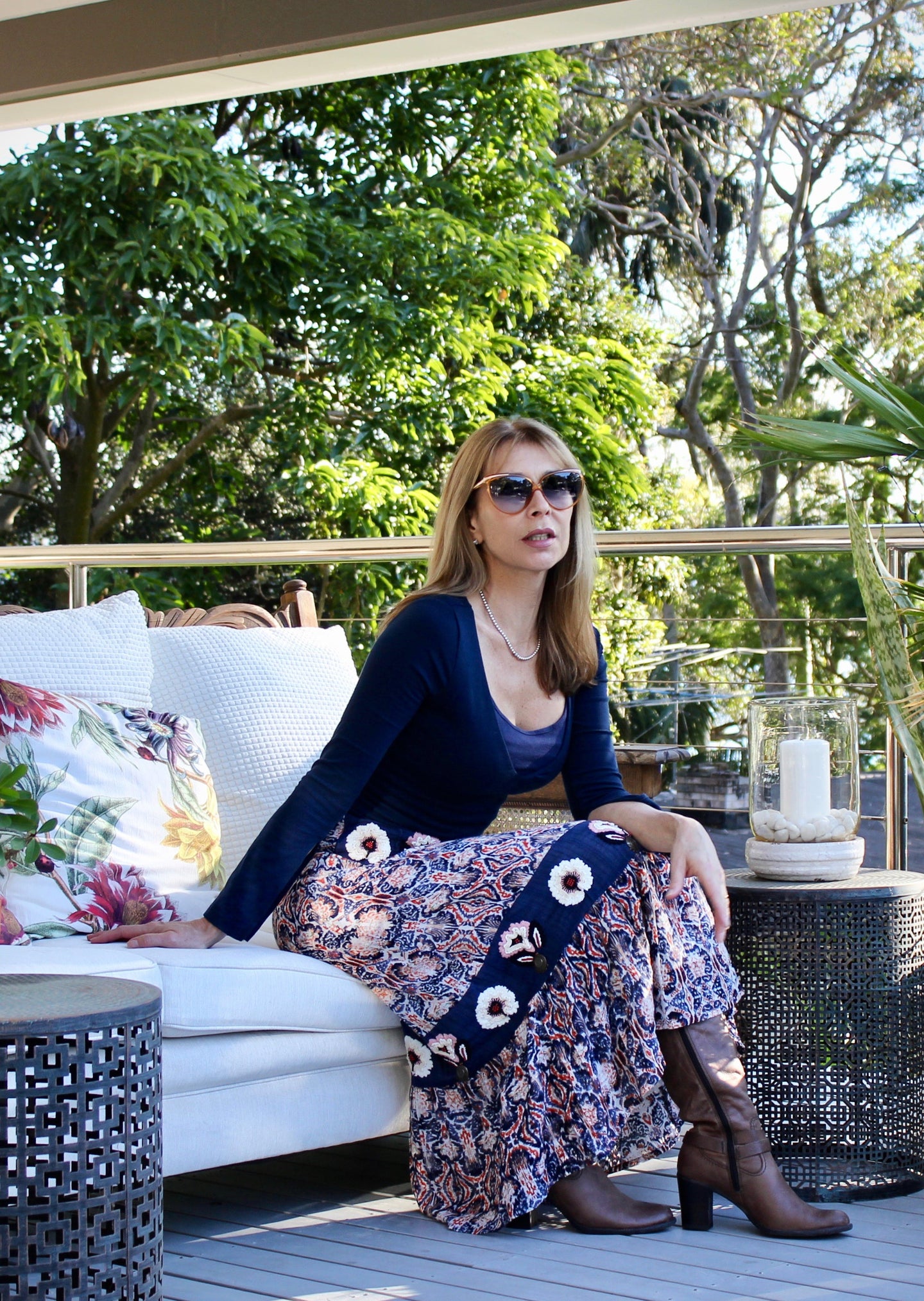 Inspired by beautiful Moroccan tiles, the ankle length Clara Skirt is made from a quality Indian cotton and features an exquisite embroidered navy panel around the hips and at mid length.  The embroidery is embellished with beading and buttons, and tiered with an exotic patterned fabric in a vibrant orange and blue to make for a really stunning skirt.
