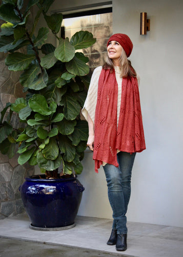 A soft versatile scarf that also doubles as a summer wrap for a layer of added warmth in summer.  This soft Mohair/acrylic knit feels light weight and warm when worn as a scarf in winter, and perfect thrown around the shoulders to keep out any chills in spring and summer.   The pretty knit combines a cable pattern to create a lovely and eye catching pattern.