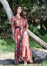 Load image into Gallery viewer, The Skye Maxi shirt dress is a gorgeous full length maxi dress, featuring a wide tiered section at the hem and side slits either side.  With a stylish shirt collar, buttoned to the chest with a seam under the bust and 3/4 cuffed sleeves. The skirt has generous volume with so much fabric, which is soft and floaty in a gorgeous red floral print.  Can be worn belted or loose with pockets

