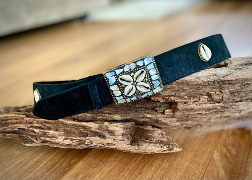 Real cow hide leather belt in rich black or tan hide with an ornate metal buckle inlaid with Mother of Pearl and Brass and stunning natural shells.   These delicate shells are also featured around the belt.  Can be worn loose or fitted, beautifully finishes any outfit.