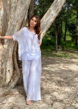 Load image into Gallery viewer, Keep it soft and feminine in these beautiful Italian made silk Primadonna Prima Pants in white on white Stripe.   The loose cut pants with a soft white on white stripe and wide jersey waistband, are fully lined and designed for relaxed style and comfort. 
