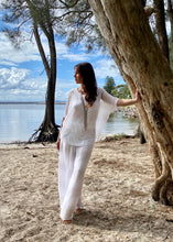 Load image into Gallery viewer, Keep it soft and feminine in these beautiful Italian made silk Primadonna Prima Pants in white on white Stripe.   The loose cut pants with a soft white on white stripe and wide jersey waistband, are fully lined and designed for relaxed style and comfort. 
