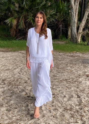 Summer Lace Top made in Italy in luxurious 100% Italian silk/viscose with fitted cami underlay.  Loose fitting and light weight, layered with a fitted cami underneath with lace boarder, this top drapes with soft femininity