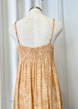 Load image into Gallery viewer, Brand: KiVARi (all things wild and free!) Circa: 2019 Style: tie front bodice with buttoned full length skirt Preloved: yes Colour: peach/white snake print Fabric: 100% Rayon lined: no Cool hand wash
